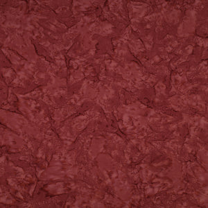 A close-up of a textured, marbled surface in a deep reddish-brown or burgundy tone, filling the entire frame.