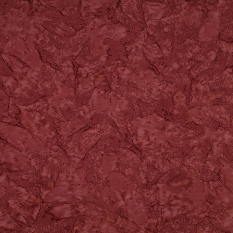 A close-up of a textured, marbled surface in a deep reddish-brown or burgundy tone, filling the entire frame.