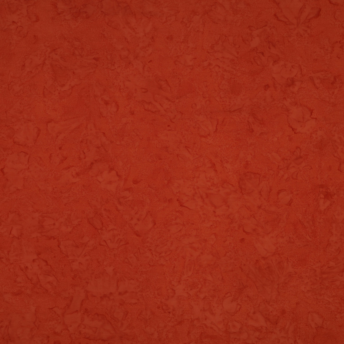 A close-up of a textured terracotta orange surface with subtle mottled variation.