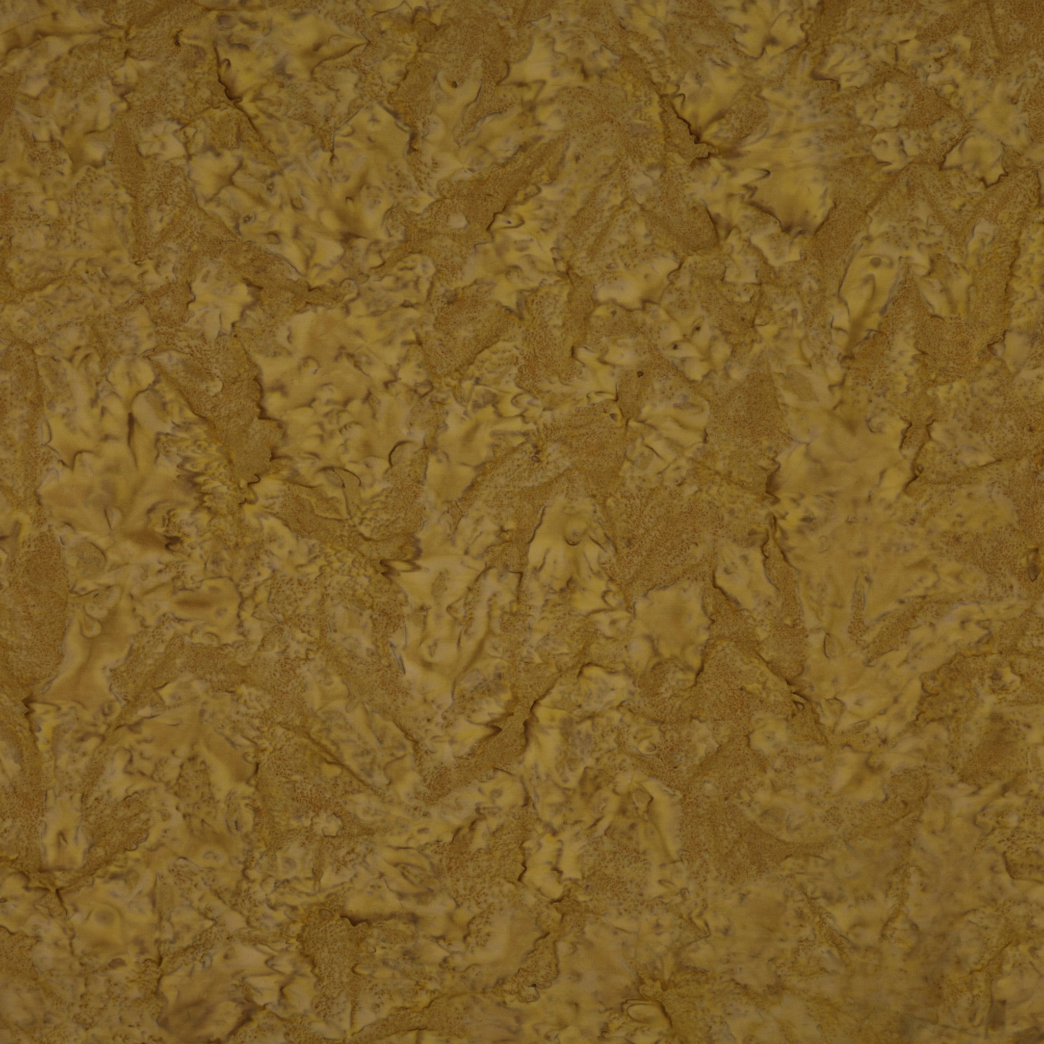 A close-up of a textured surface with a mottled, organic pattern in warm mustard yellow, golden brown, and tan tones.