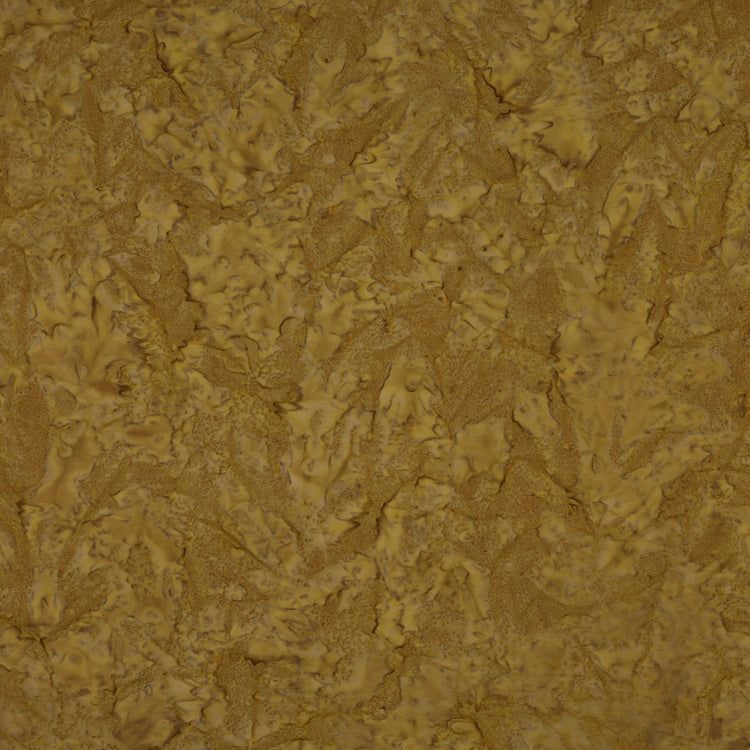 A close-up of a textured surface with a mottled, organic pattern in warm mustard yellow, golden brown, and tan tones.