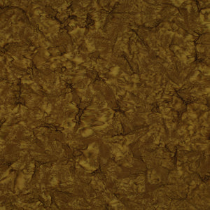 A close-up of a textured material swatch with a mottled, organic pattern in earthy brown and golden-brown tones.