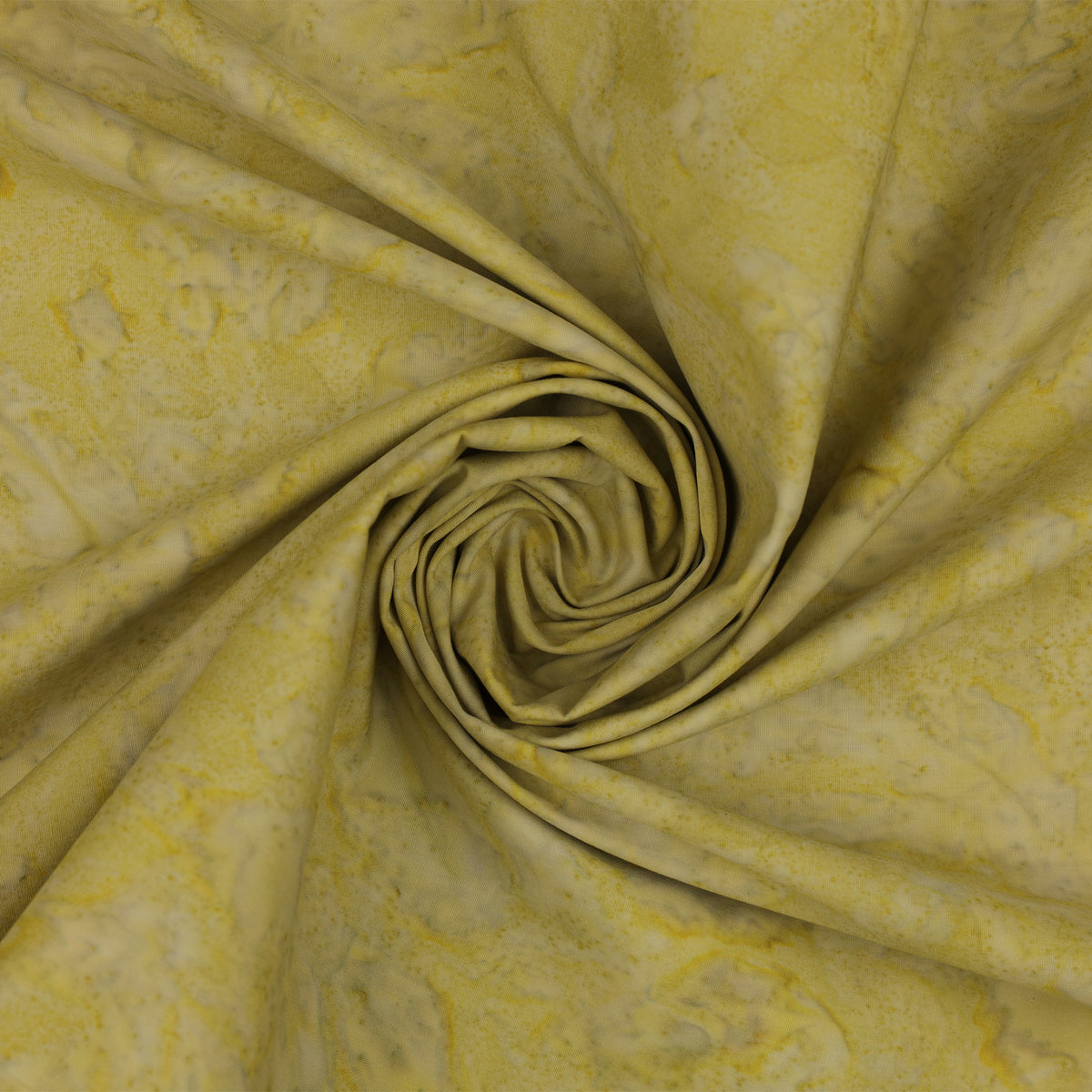Yellow fabric with a marbled pattern, arranged in a spiral swirl to show its texture and drape.