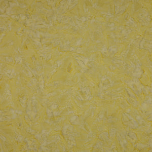 A close-up of a textured yellow fabric showing a mottled pattern.