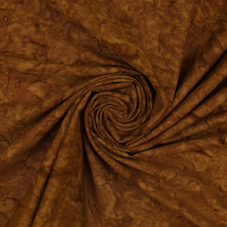 Brown mottled fabric with a marbled pattern, arranged in a spiral swirl to show texture and drape.