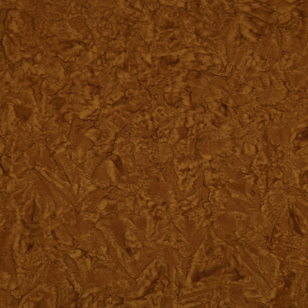 A close-up of a brown textured material with a mottled, organic surface pattern.