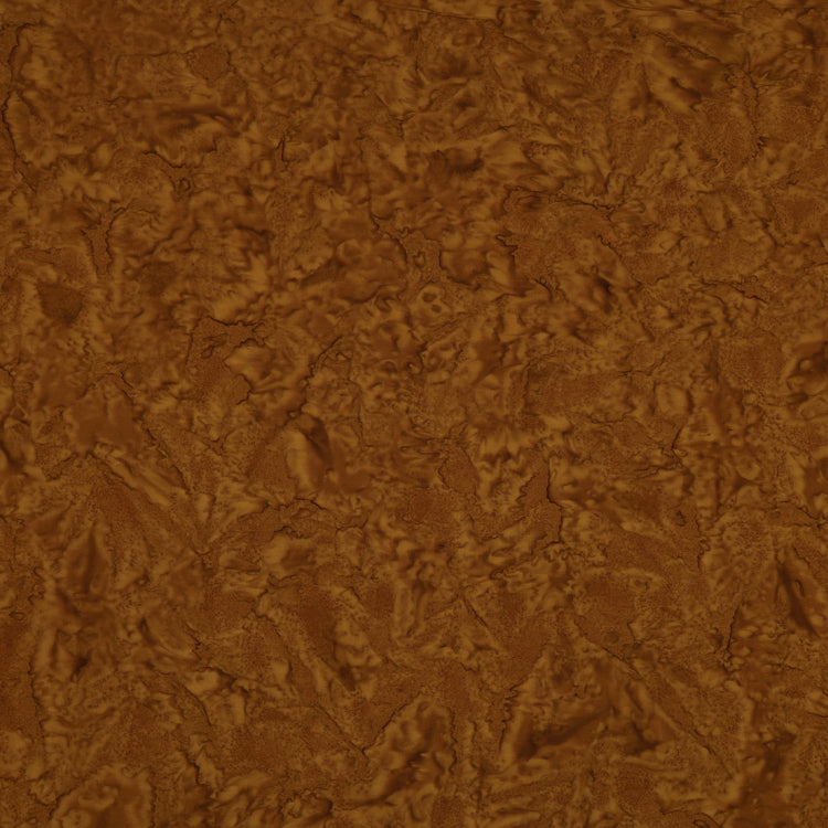 A close-up of a brown textured material with a mottled, organic surface pattern.