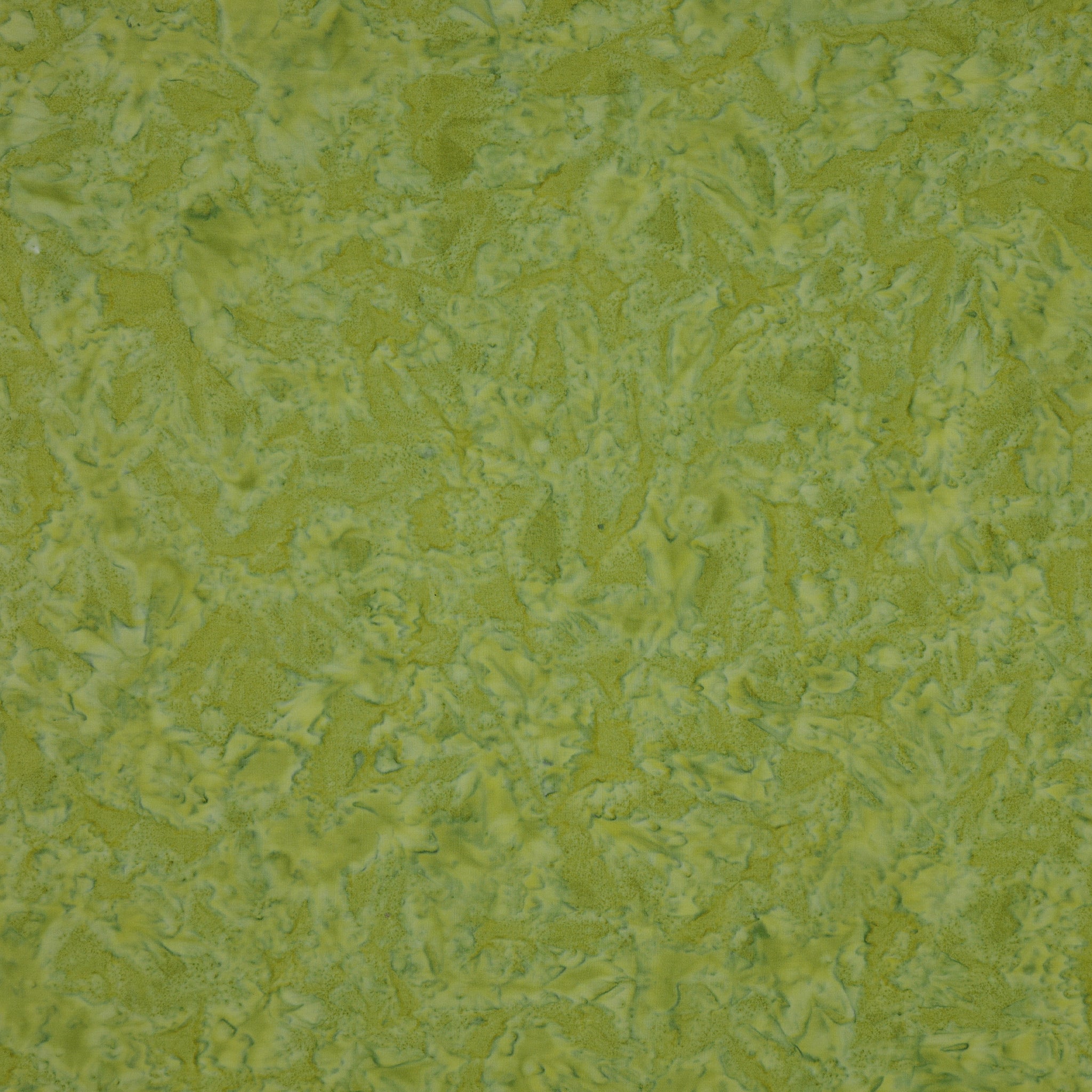 A close-up texture of a green fabric or wallpaper material with a mottled, organic pattern.