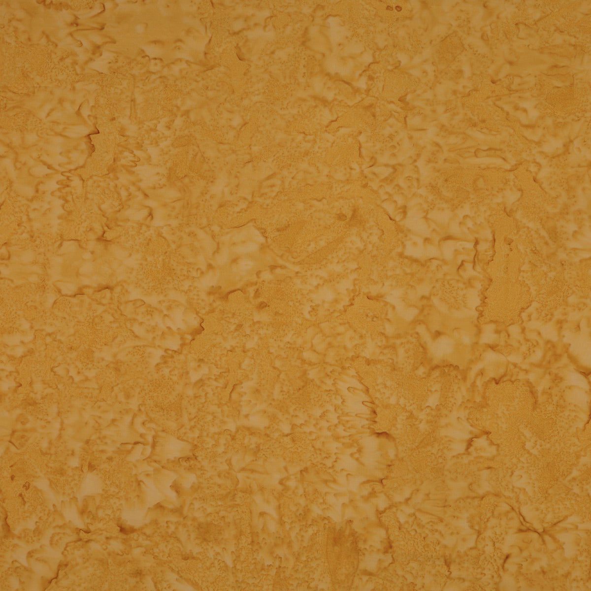 A close-up of a textured, mottled surface in warm golden yellow and orange-brown tones, filling the entire frame.