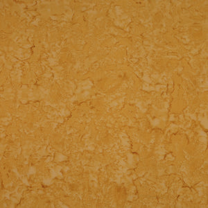A close-up of a textured, mottled surface in warm golden yellow and orange-brown tones, filling the entire frame.