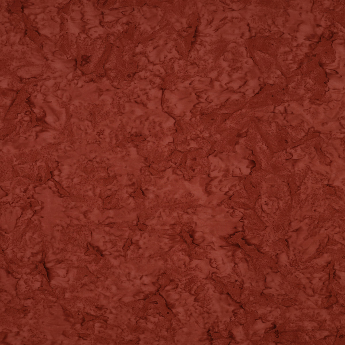 A close-up of a textured terracotta or rust-colored material with a mottled, organic surface pattern.