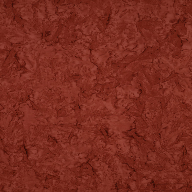 A close-up of a textured terracotta or rust-colored material with a mottled, organic surface pattern.