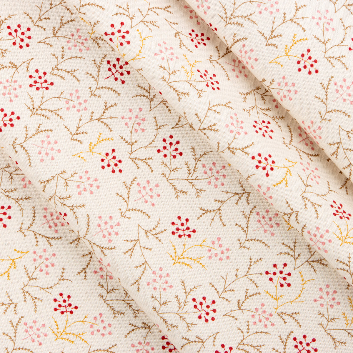 Cream fabric with delicate red and pink berry sprigs and fine brown branches.