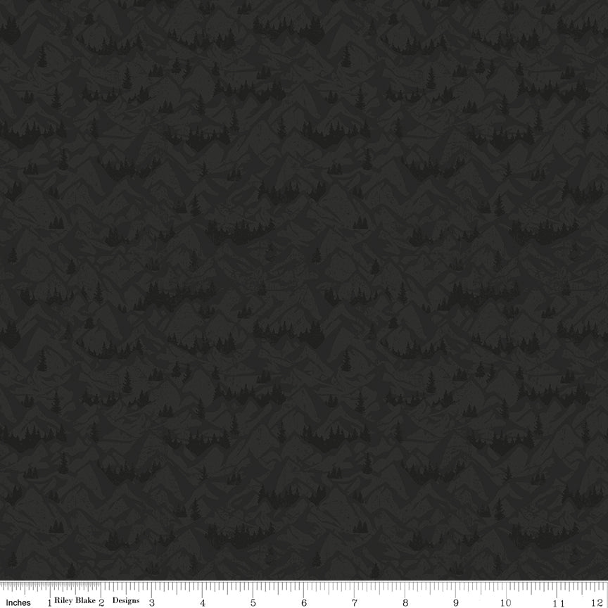 Charcoal fabric with tonal mountain ranges, valleys, and evergreen tree silhouettes with ruler for scale.