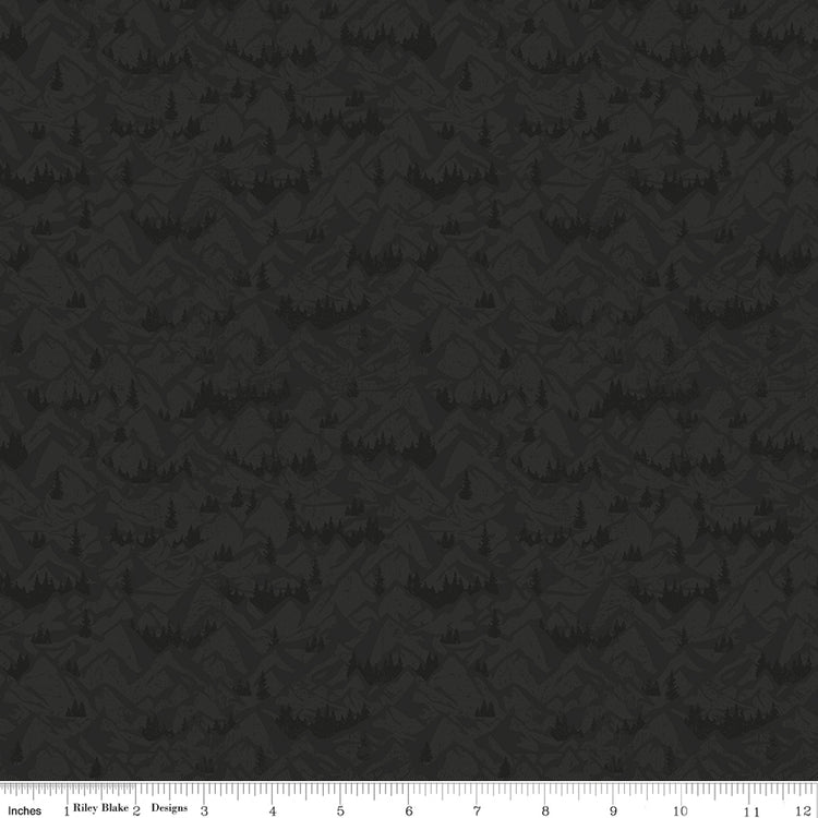 Charcoal fabric with tonal mountain ranges, valleys, and evergreen tree silhouettes with ruler for scale.