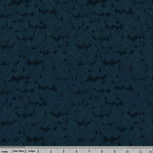 Navy blue fabric with layered mountain ranges and dark evergreen forest silhouettes with ruler for scale.
