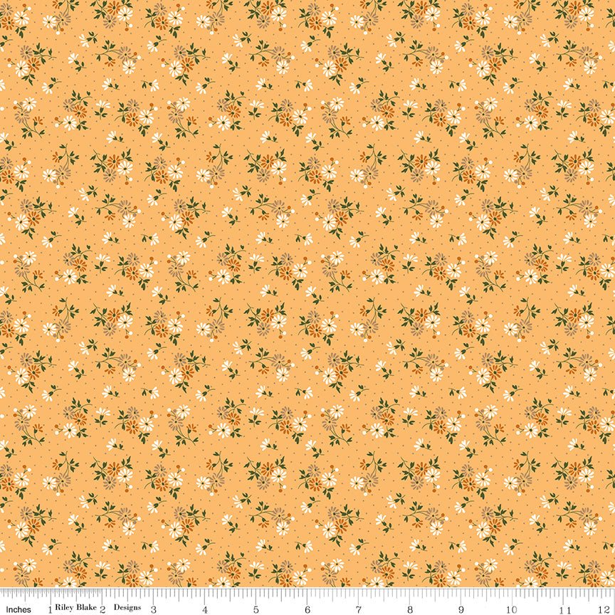 Floral pattern fabric on a peach background with a ruler along the bottom for scale. 
