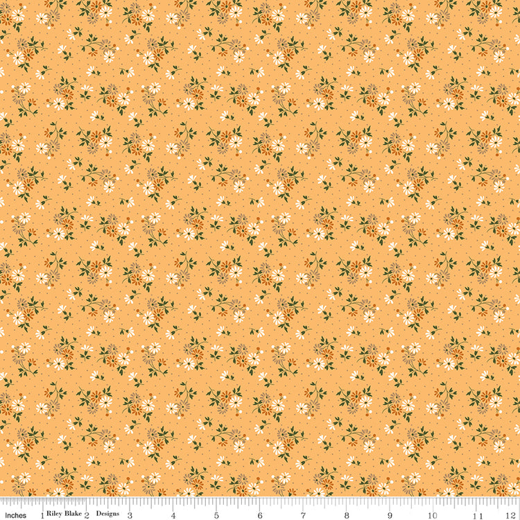Floral pattern fabric on a peach background with a ruler along the bottom for scale. 