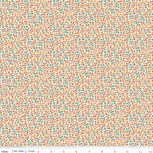 Floral patterned fabric with a ruler at the bottom for scale