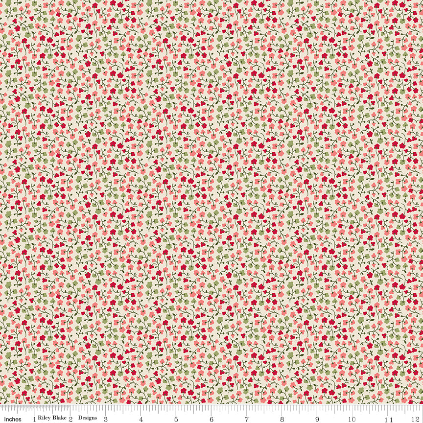 A seamless fabric pattern featuring a dense, small-scale print of red berries and green leaves on a warm cream background. A ruler along the bottom for scale.
