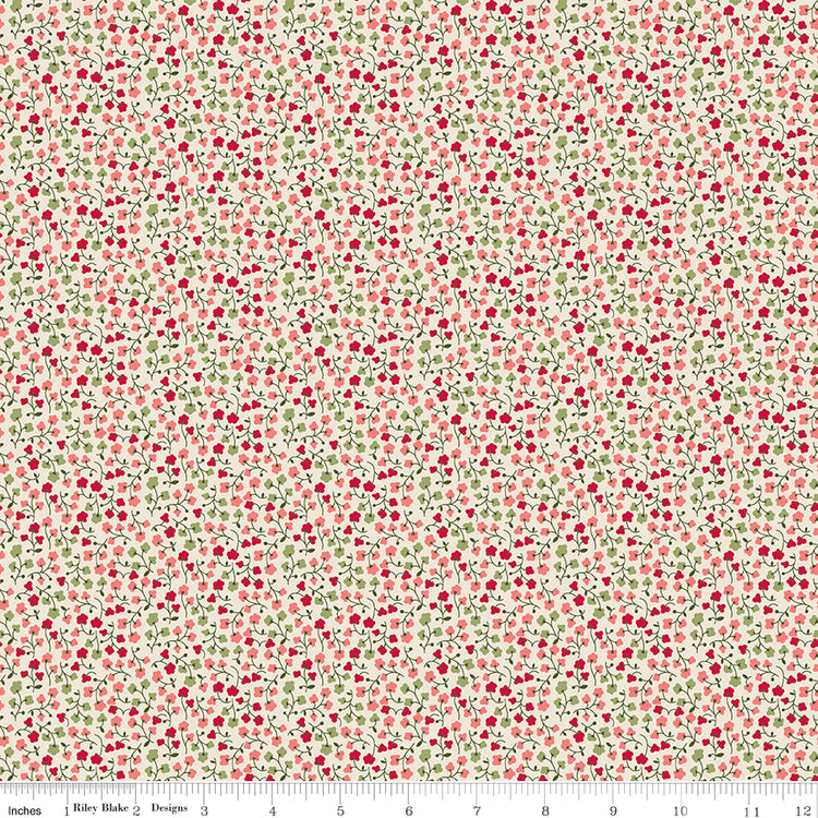 A seamless fabric pattern featuring a dense, small-scale print of red berries and green leaves on a warm cream background. A ruler along the bottom for scale.