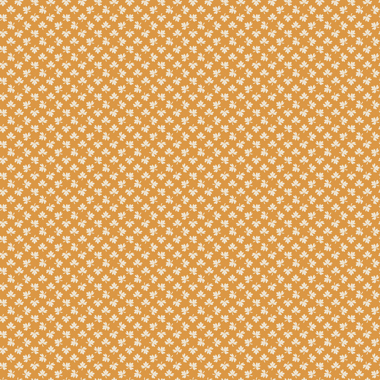 A repeating pattern of small white floral motifs on a warm orange background, filling the entire frame.