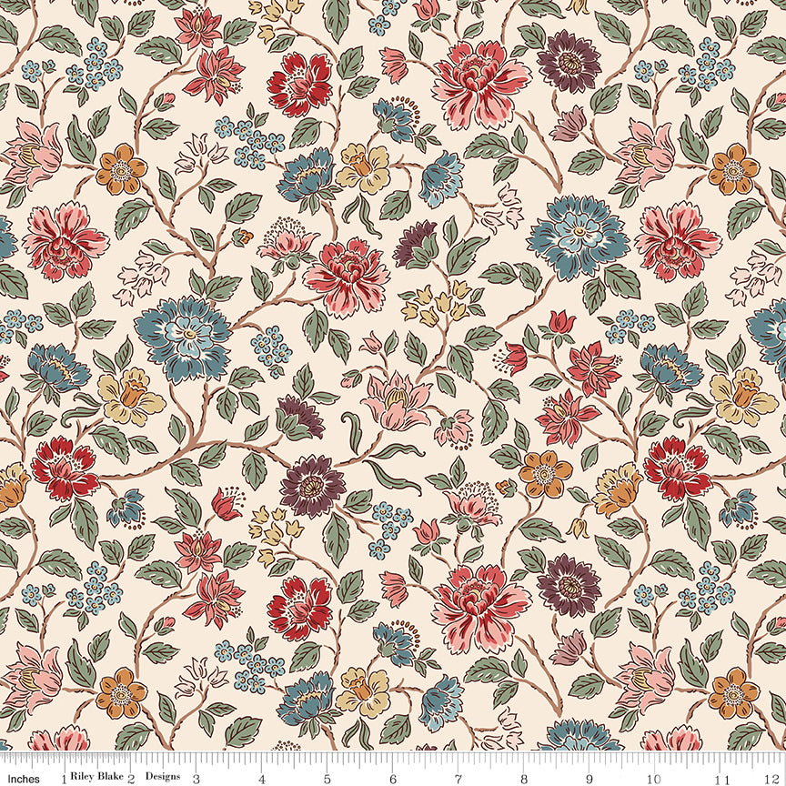 Northanger Abbey Morland Cream floral fabric with red, blue, blush, gold, and green flowers on a soft cream background with ruler for scale.