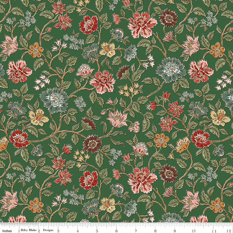 Northanger Abbey Morland Green floral fabric with coral, blue, blush, gold, and burgundy flowers on a rich green background with ruler for scale.