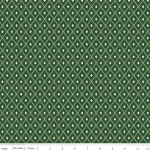 Northanger Abbey Thorpe Green fabric with cream diamond lattice and tiny flowers on deep green with ruler for scale.