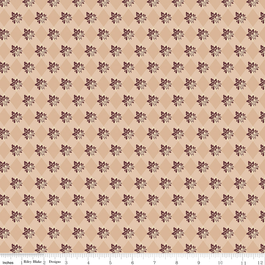 Northanger Abbey James fabric with plum floral sprigs over a tan and cream diamond pattern with ruler for scale.