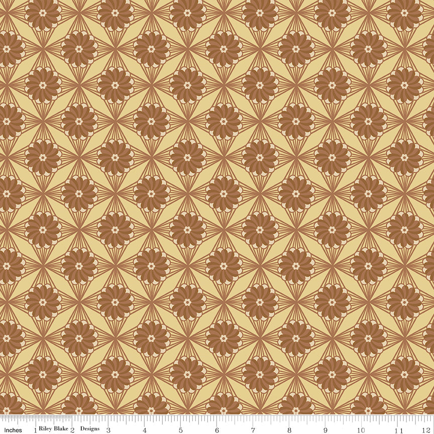 Northanger Abbey Fullerton fabric with brown flowers and radiating geometric lines on warm tan with ruler for scale.