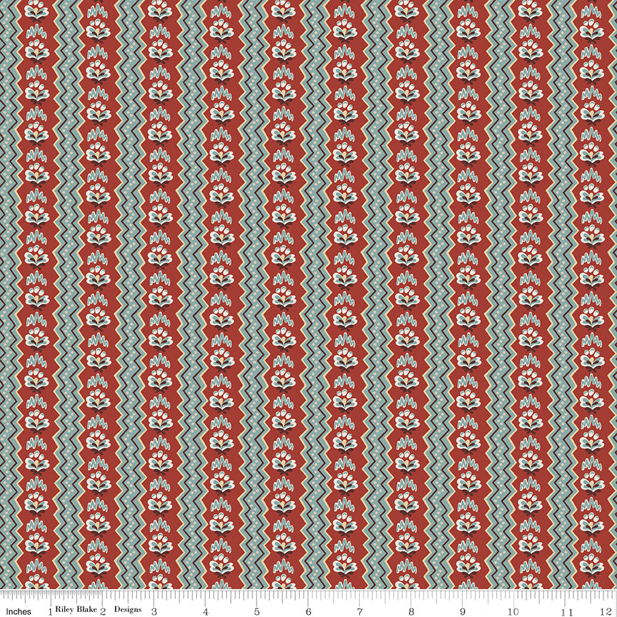 Northanger Abbey General fabric with rust floral stripes, teal accents, and cream zigzag bands with ruler for scale.