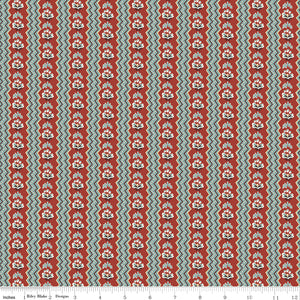 Northanger Abbey General fabric with rust floral stripes, teal accents, and cream zigzag bands with ruler for scale.