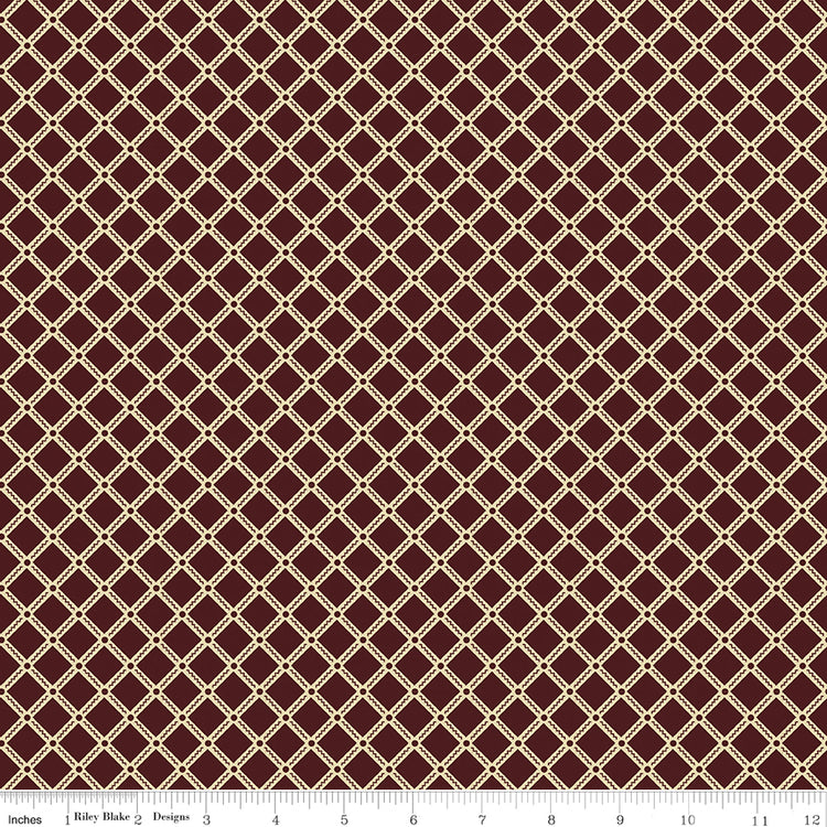 Northanger Abbey Tilney Merlot fabric with cream lattice diamonds on a deep merlot background with ruler for scale.