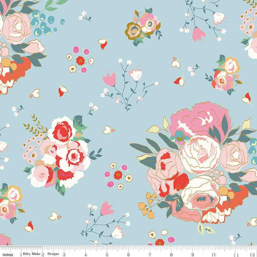 Cotton Nook Main Sky fabric with large pink, cream and coral floral bouquets on soft blue with ruler for scale.