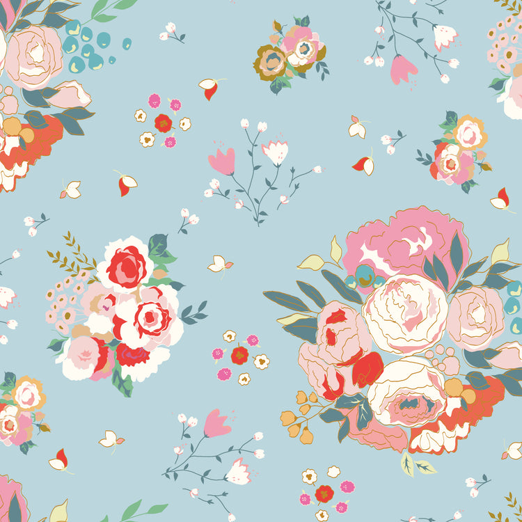 Cotton Nook Main Sky fabric with large pink, cream and coral floral bouquets on soft blue.