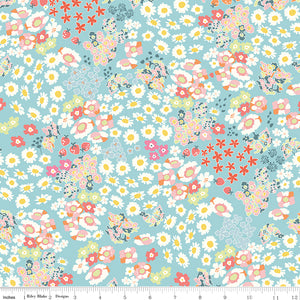 Cotton Nook Flowerbed Aqua fabric with daisies, strawberries and colorful flowers on aqua with ruler for scale.
