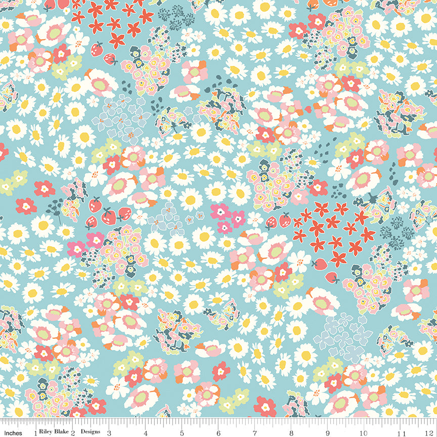 Cotton Nook Flowerbed Aqua fabric with daisies, strawberries and colorful flowers on aqua with ruler for scale.