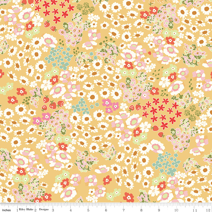 Cotton Nook Flowerbed Yellow fabric with daisies, strawberries and florals on sunny yellow with ruler for scale.