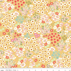 Cotton Nook Flowerbed Yellow fabric with daisies, strawberries and florals on sunny yellow with ruler for scale.