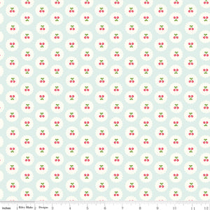 Cotton Nook Cherries Bleached Denim fabric with tiny cherries in white scalloped circles with ruler for scale.