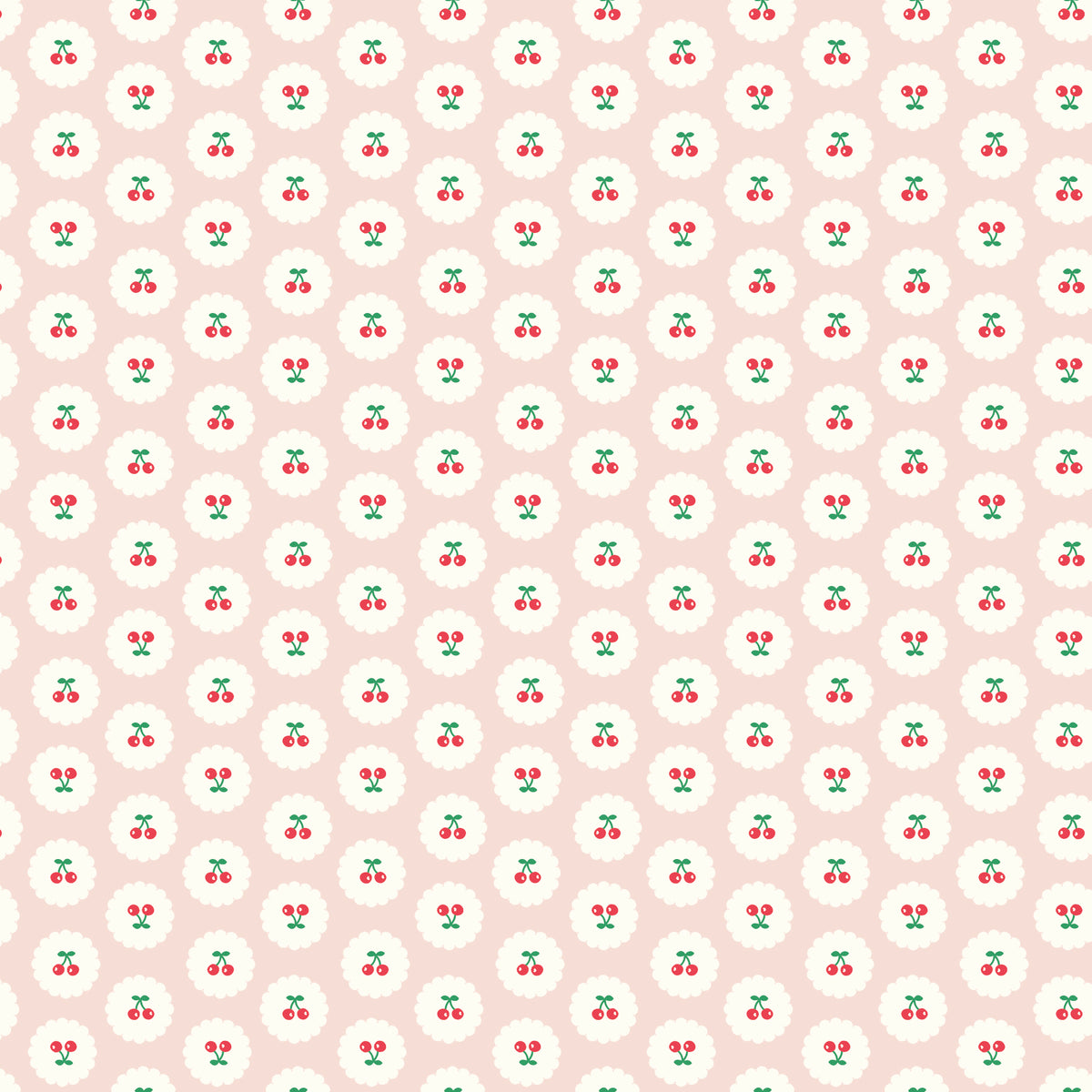 Cotton Nook Cherries Blush fabric with red cherries inside white scalloped circles on pale pink.
