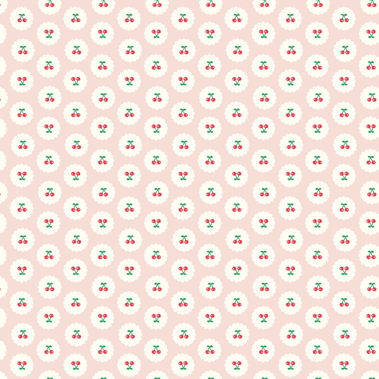 Cotton Nook Cherries Blush fabric with red cherries inside white scalloped circles on pale pink.