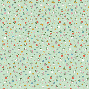 Cotton Nook Pretty Mint fabric with scattered colorful petite flowers on a soft mint green background.