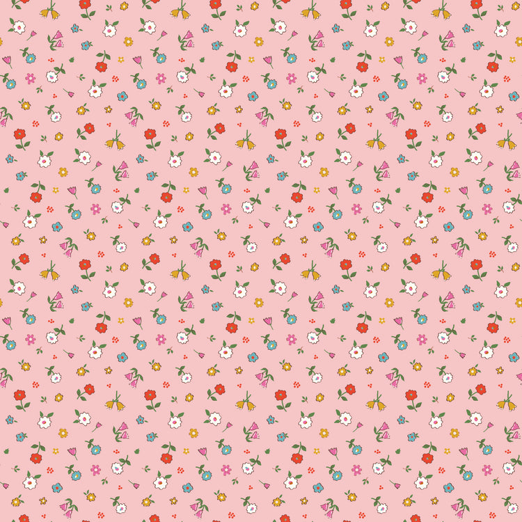 Cotton Nook Pretty Pink fabric with tiny colorful flowers and leafy sprigs on a soft pink background.