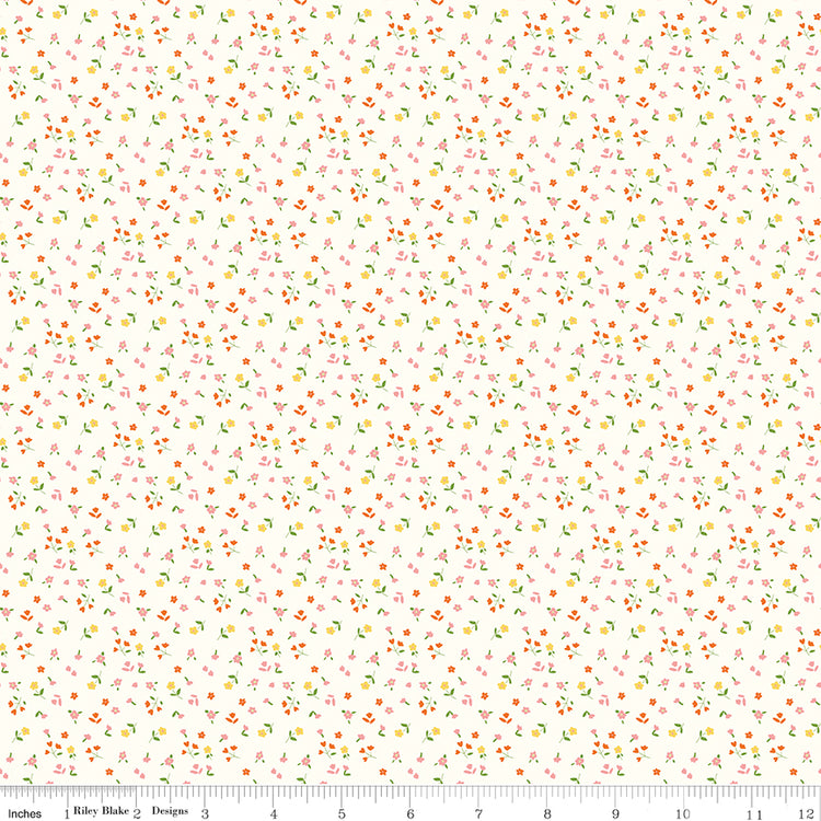 Cotton Nook Flowers Vintage White fabric with tiny pink, orange and yellow floral sprigs with ruler for scale.