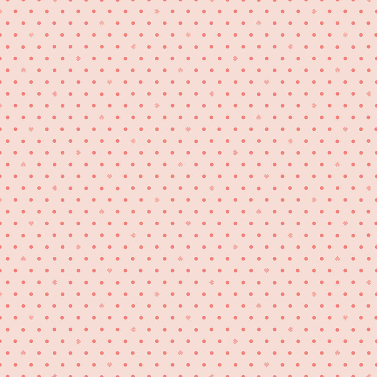 Cotton Nook Dots Blush fabric with small coral dots scattered across a pale blush background.