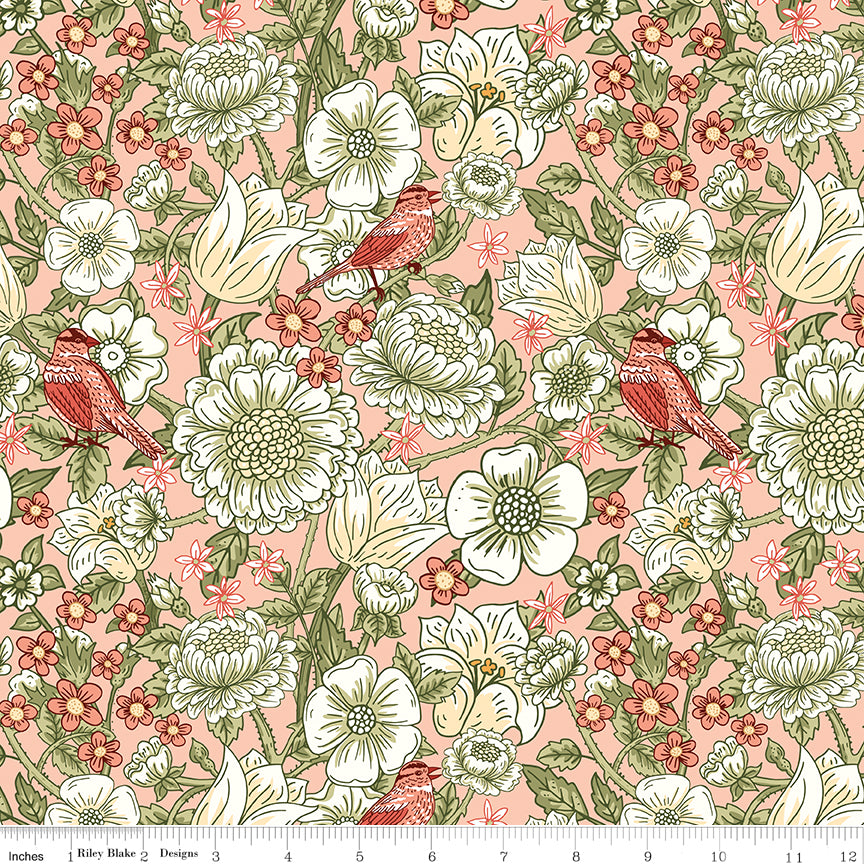Blush pink floral fabric with cream flowers, green leaves, and coral birds with a ruler along the bottom for scale. 