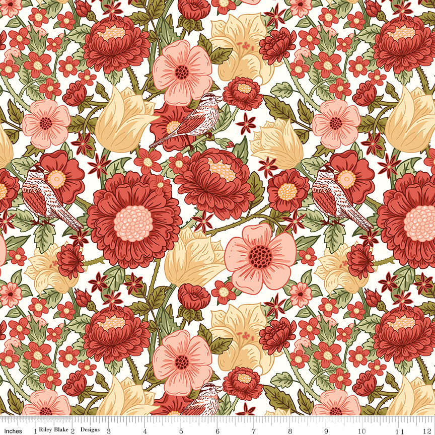 Cream floral fabric with red and pink flowers, green leaves, and birds; ruler along the bottom for scale. 