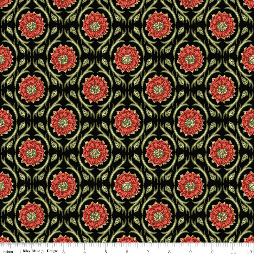 Black fabric with repeating red floral medallions and olive green vines with a ruler along the bottom for scale